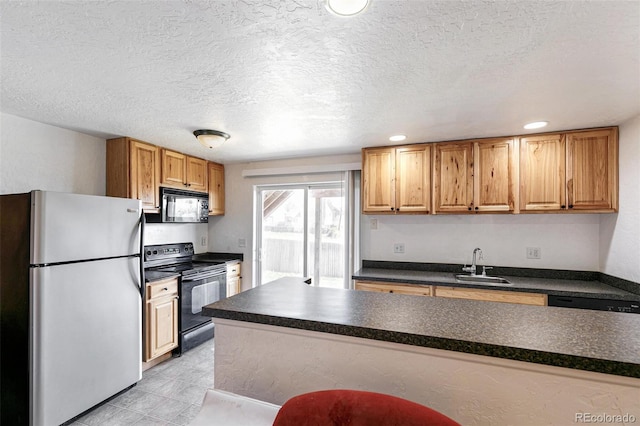 kitchen with freestanding refrigerator, black electric range, a sink, dark countertops, and a textured ceiling