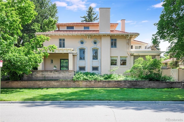 199 Lafayette St, Denver, CO 80218 - view of front facade with stucco siding, a chimney, a front yard, and a tile roof