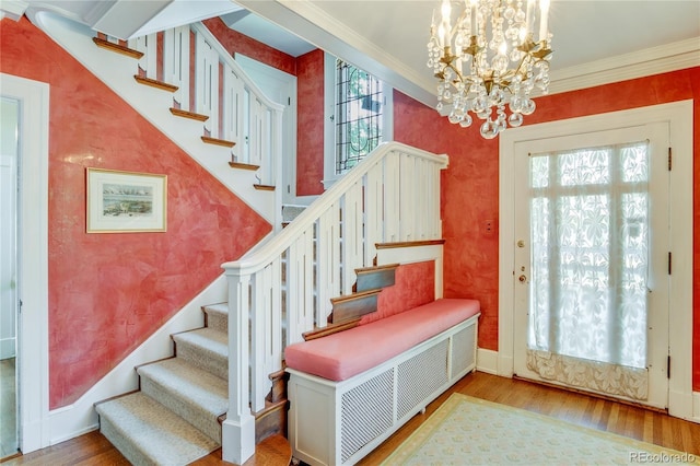 199 Lafayette St, Denver, CO 80218 - entryway with a chandelier, stairway, crown molding, and wood finished floors