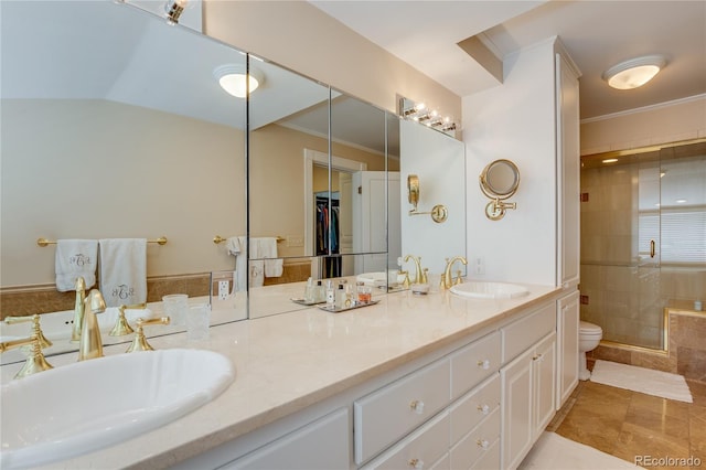 199 Lafayette St, Denver, CO 80218 - bathroom with double vanity, a stall shower, ornamental molding, and vaulted ceiling