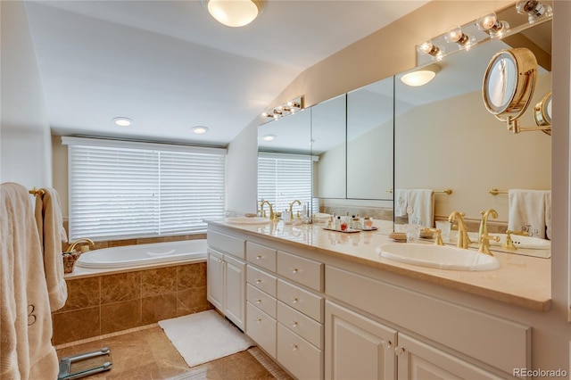199 Lafayette St, Denver, CO 80218 - bathroom with double vanity, a garden tub, tile patterned floors, and vaulted ceiling
