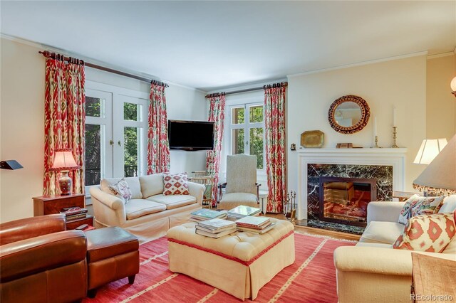 199 Lafayette St, Denver, CO 80218 - living area with crown molding, french doors, a fireplace, and wood finished floors