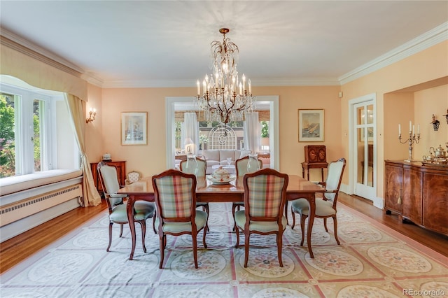 199 Lafayette St, Denver, CO 80218 - dining room with crown molding, plenty of natural light, a chandelier, and wood finished floors