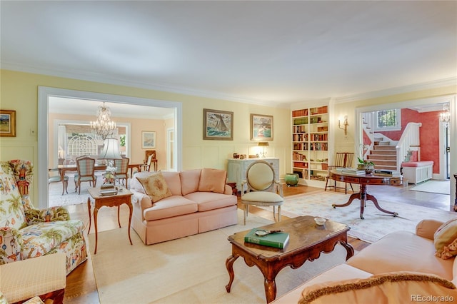 199 Lafayette St, Denver, CO 80218 - living area featuring ornamental molding, a chandelier, built in shelves, stairway, and wood finished floors