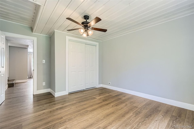 2726 W 1st Ave, Denver, CO 80219 - unfurnished bedroom featuring a closet, wooden ceiling, wood finished floors, and a ceiling fan