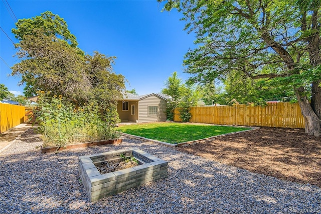 2726 W 1st Ave, Denver, CO 80219 - fenced backyard featuring a vegetable garden