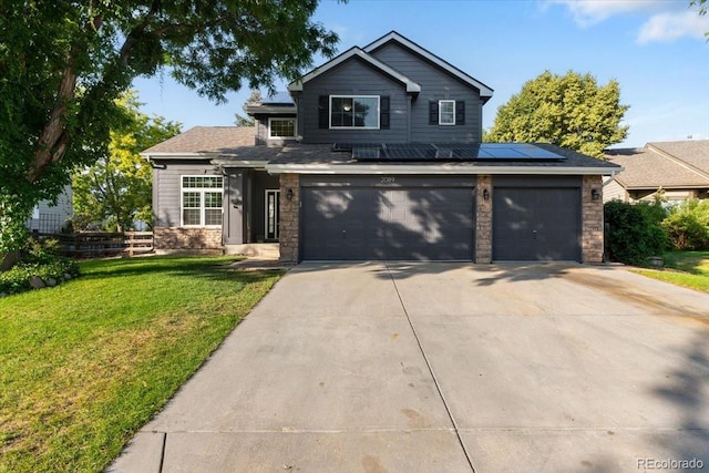 2089 Meadow Sweet Ln, Erie, CO 80516 - traditional home with stone siding, driveway, solar panels, and a garage