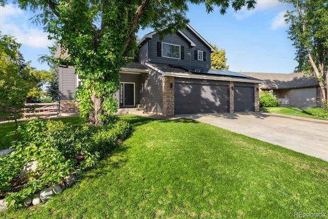 2089 Meadow Sweet Ln, Erie, CO 80516 - traditional-style house with a front yard, concrete driveway, and solar panels