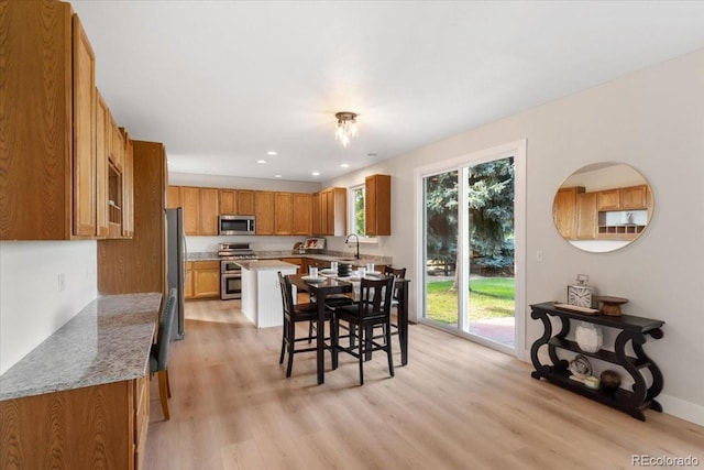 2089 Meadow Sweet Ln, Erie, CO 80516 - dining space with plenty of natural light, light wood-style floors, and recessed lighting