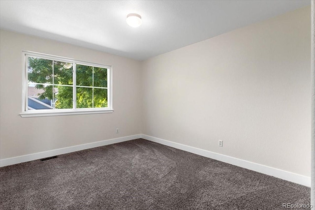 2089 Meadow Sweet Ln, Erie, CO 80516 - unfurnished room featuring dark colored carpet and baseboards