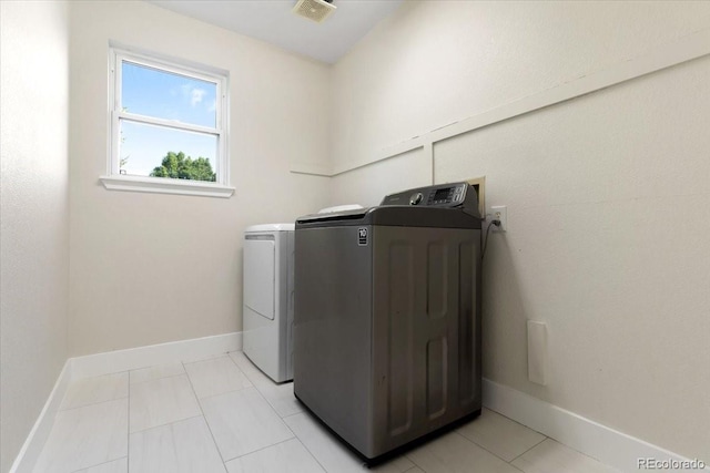 2089 Meadow Sweet Ln, Erie, CO 80516 - laundry room with independent washer and dryer and baseboards