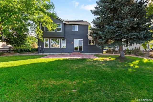 2089 Meadow Sweet Ln, Erie, CO 80516 - back of house with solar panels, a patio, and entry steps