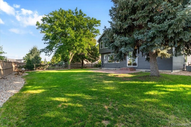 2089 Meadow Sweet Ln, Erie, CO 80516 - fenced backyard featuring entry steps and a patio