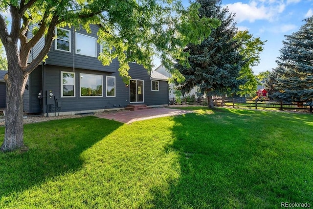 2089 Meadow Sweet Ln, Erie, CO 80516 - rear view of house with entry steps and a patio area