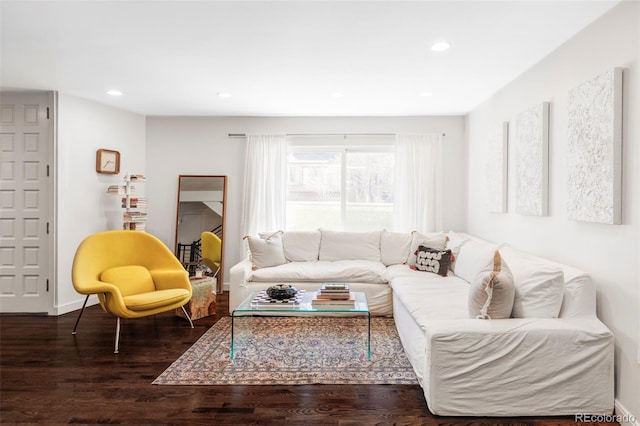 living area with recessed lighting, baseboards, and wood finished floors