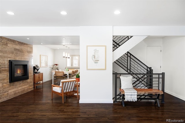 interior space with recessed lighting, wood finished floors, and a fireplace