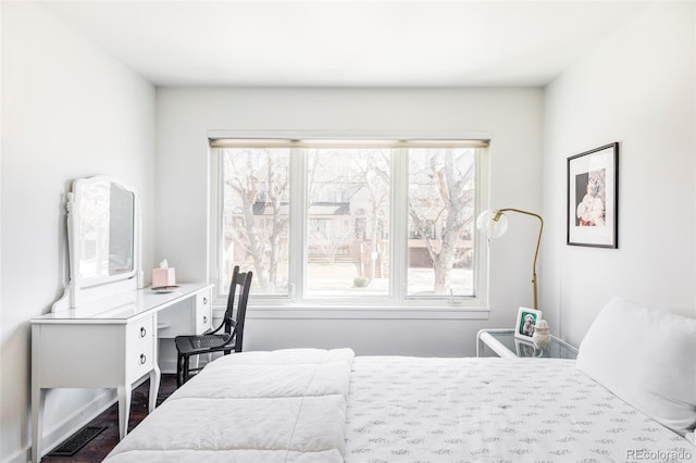 bedroom featuring multiple windows