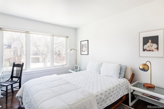 bedroom with wood finished floors