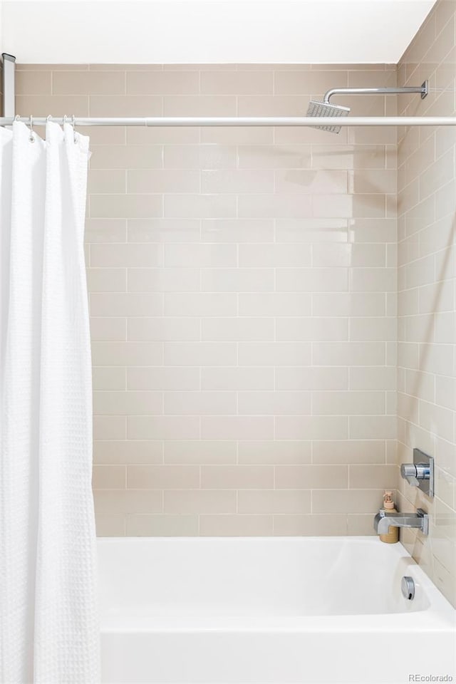 full bathroom featuring shower / bath combination with curtain