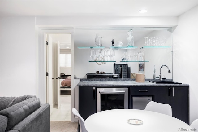 bar with wet bar, wine cooler, and a sink