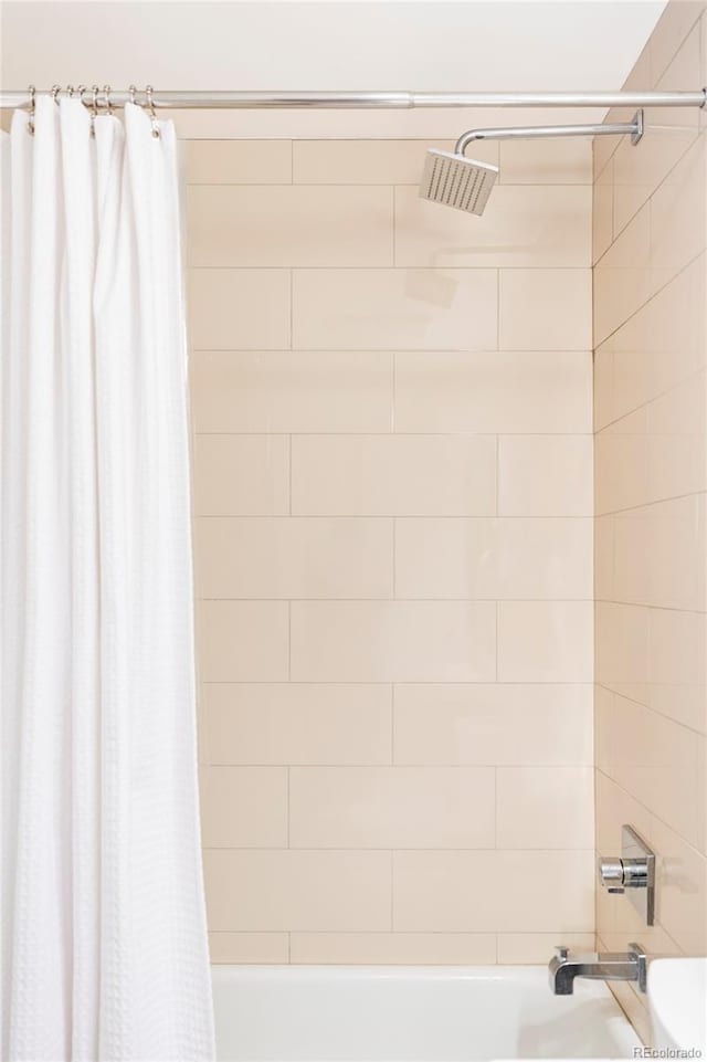 full bathroom with shower / bath combo with shower curtain