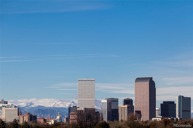 property's view of city with a mountain view