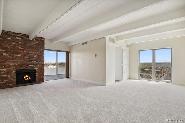 130 N Pearl St Unit 1103, Denver, CO 80203 - unfurnished living room featuring carpet flooring, a healthy amount of sunlight, and beamed ceiling