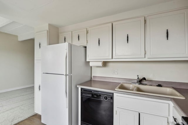 130 N Pearl St Unit 1103, Denver, CO 80203 - kitchen with a sink, baseboards, freestanding refrigerator, black dishwasher, and white cabinetry