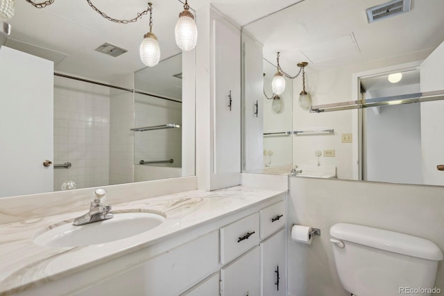 130 N Pearl St Unit 1103, Denver, CO 80203 - bathroom featuring vanity, walk in shower, toilet, and visible vents
