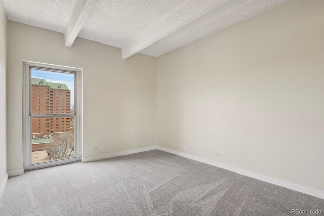 130 N Pearl St Unit 1103, Denver, CO 80203 - carpeted empty room with a textured ceiling, baseboards, and beam ceiling