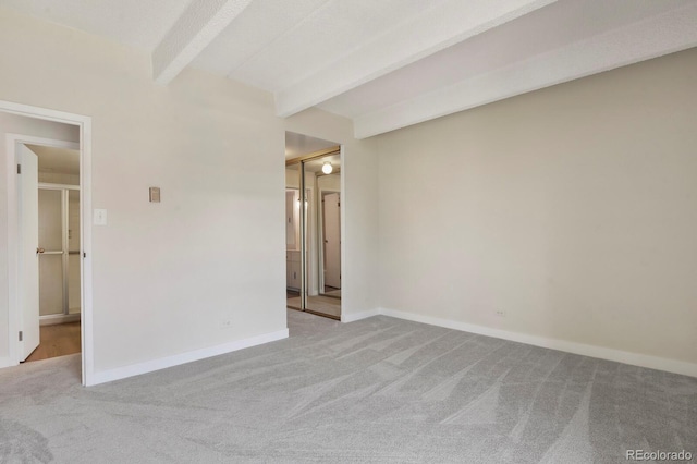 130 N Pearl St Unit 1103, Denver, CO 80203 - unfurnished room featuring baseboards, carpet, and beamed ceiling