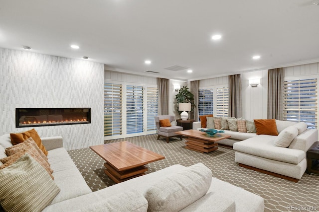130 N Pearl St Unit 1103, Denver, CO 80203 - carpeted living area with recessed lighting, ornamental molding, and a fireplace