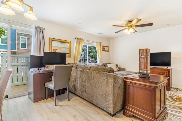 5895 Biscay St Unit D, Denver, CO 80249 - living room featuring light wood-style floors and a ceiling fan
