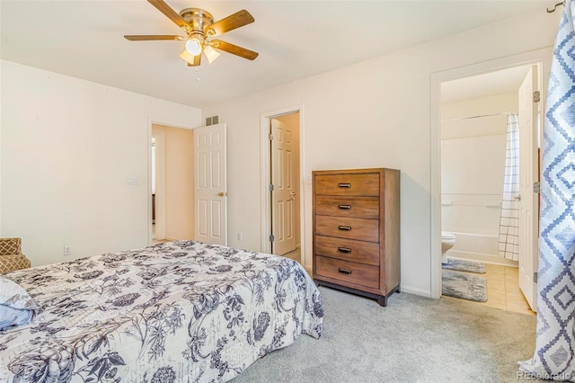 5895 Biscay St Unit D, Denver, CO 80249 - bedroom with light colored carpet, ensuite bathroom, and a ceiling fan