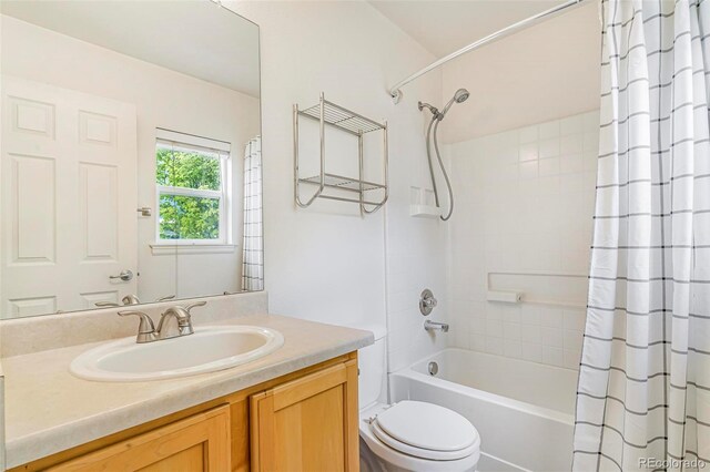 5895 Biscay St Unit D, Denver, CO 80249 - full bath with toilet, shower / bathtub combination with curtain, and vanity