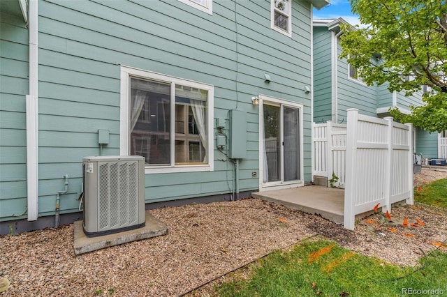 5895 Biscay St Unit D, Denver, CO 80249 - rear view of house with central AC unit