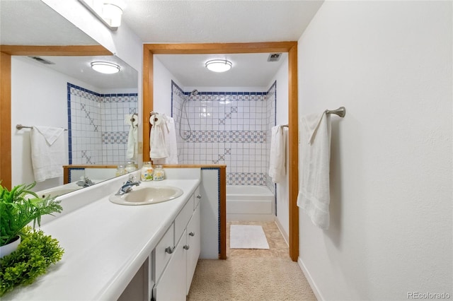 full bathroom featuring vanity, washtub / shower combination, and baseboards