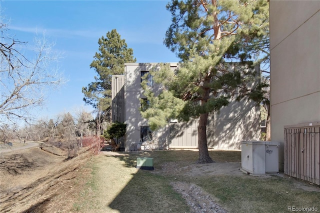 view of side of property featuring fence