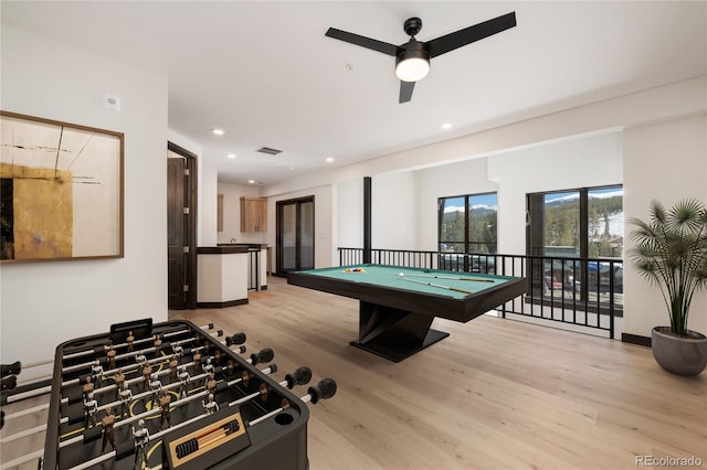 playroom featuring ceiling fan, pool table, and light hardwood / wood-style flooring