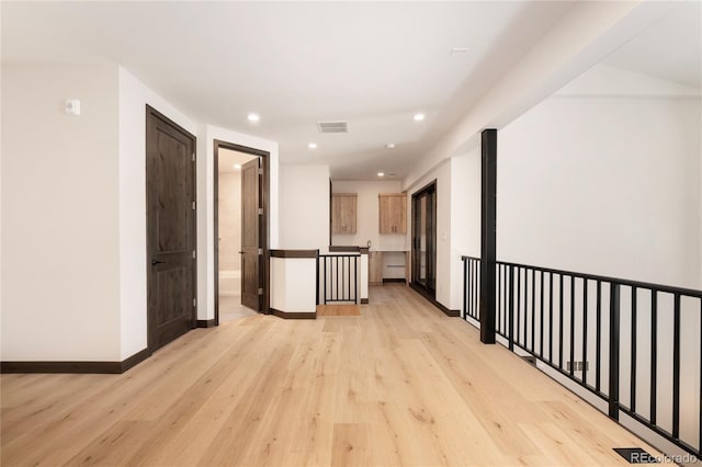 hallway featuring light wood-type flooring