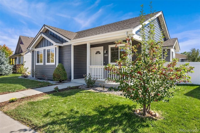 view of front of house featuring a porch and a front lawn