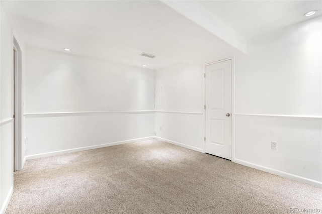 unfurnished room with light colored carpet