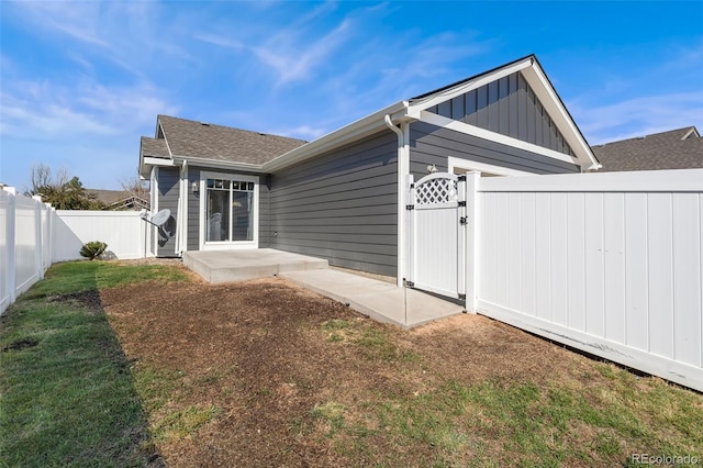 rear view of house with a lawn