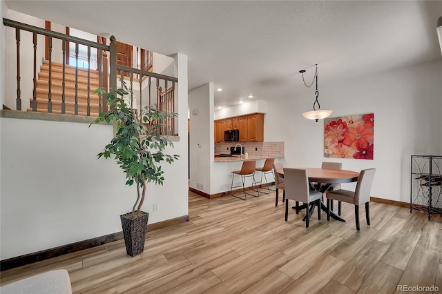 2972 W Long Dr Unit C, Littleton, CO 80120 - dining room featuring light wood-style flooring, stairs, and recessed lighting