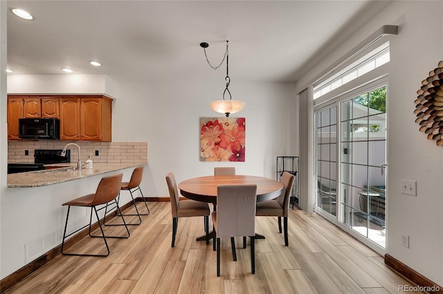 2972 W Long Dr Unit C, Littleton, CO 80120 - dining space featuring light wood finished floors and recessed lighting