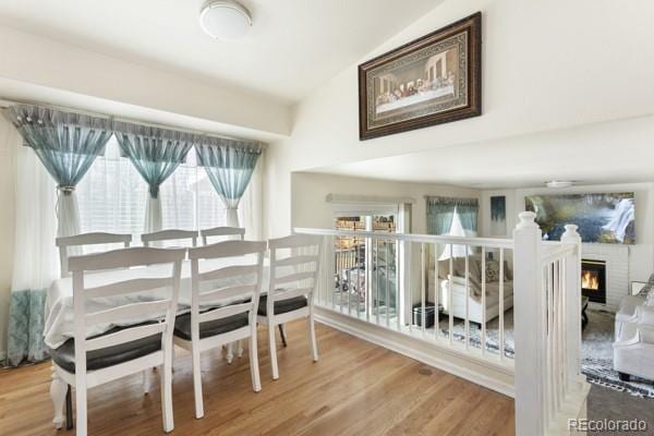 dining space with hardwood / wood-style flooring