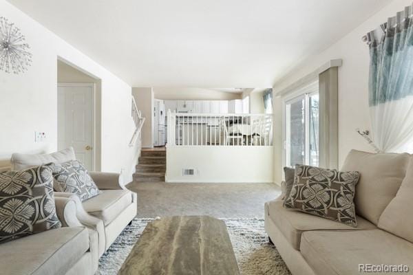 living room featuring light carpet