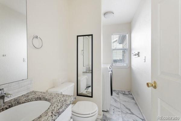 bathroom with vanity and toilet