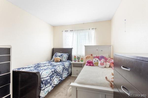 bedroom with light colored carpet