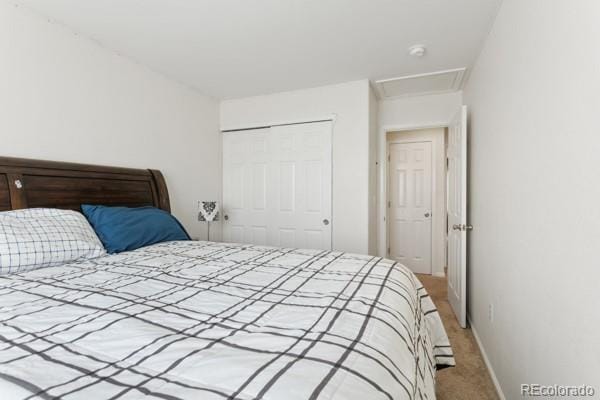 carpeted bedroom with a closet